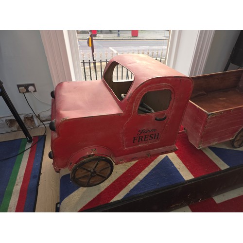 26 - A champagne cart in the form of a vintage lorry and trailer, steel construction with faux spoke whee... 