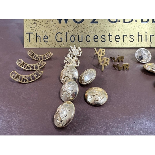 29 - A selection of military related objects to include a brass desk name plate WO2 GD Bloor, The Glouces... 