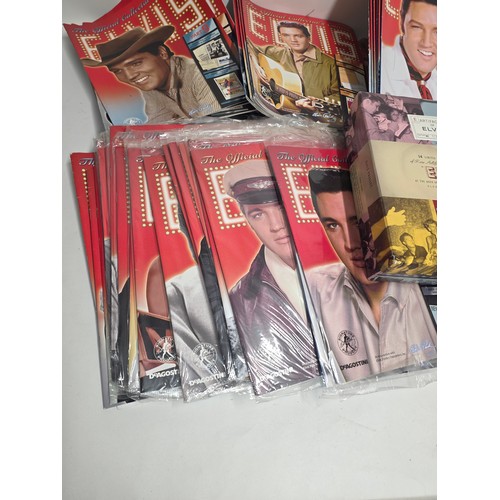 31 - Elvis Presley, aprox 86 of the official collector's edition Elvis magazines some still vacuum sealed... 
