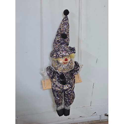 38 - Vintage puppet style young clown with porcelain face and stuffed body on a string. Length of doll is... 