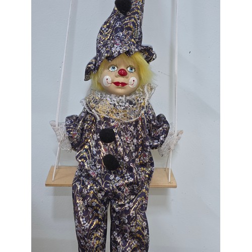 38 - Vintage puppet style young clown with porcelain face and stuffed body on a string. Length of doll is... 