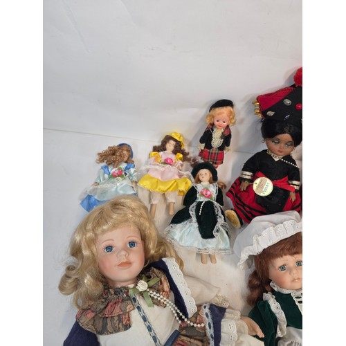 39 - Collector dolls, nine in total some porcelain, in various outfits including Victorian and Folk style