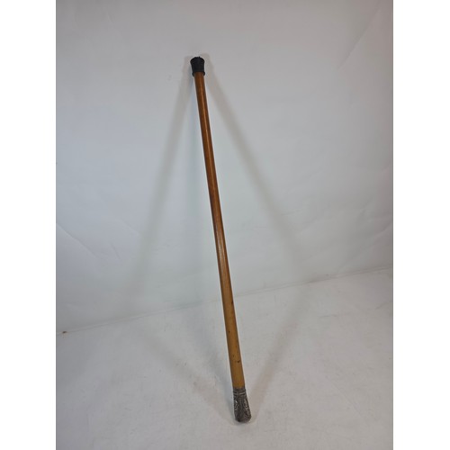 An Indian silver topped walking cane, decorated with various deities