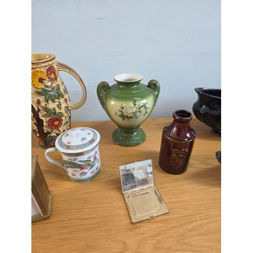 16 - Mixed lot to include ceramics, a brass cased carriage clock and a vintage Revlon compact