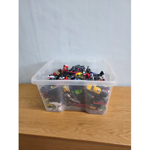 19 - A large collection of playworn die cast vehicles in a plastic crate