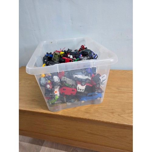 19 - A large collection of playworn die cast vehicles in a plastic crate