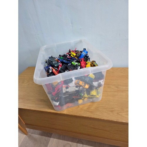 19 - A large collection of playworn die cast vehicles in a plastic crate