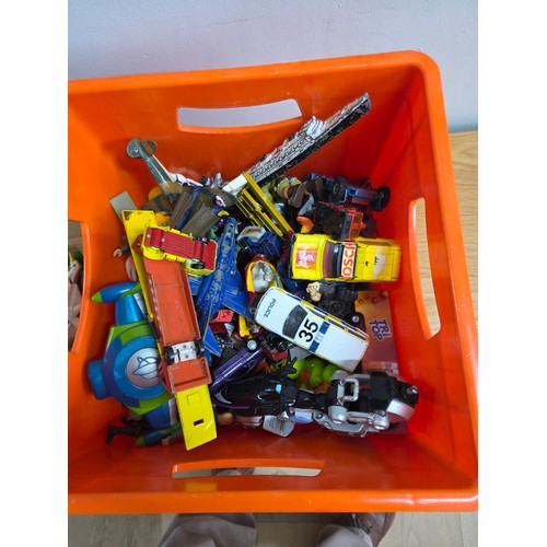 20 - A collection of playworn die cast vehicles and action figures in a plastic crate
