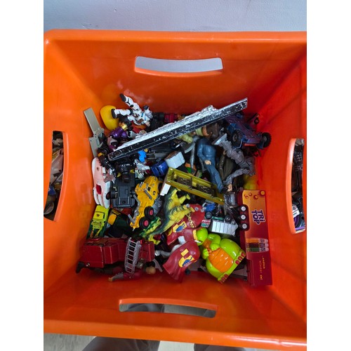 20 - A collection of playworn die cast vehicles and action figures in a plastic crate