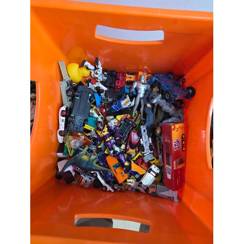 20 - A collection of playworn die cast vehicles and action figures in a plastic crate
