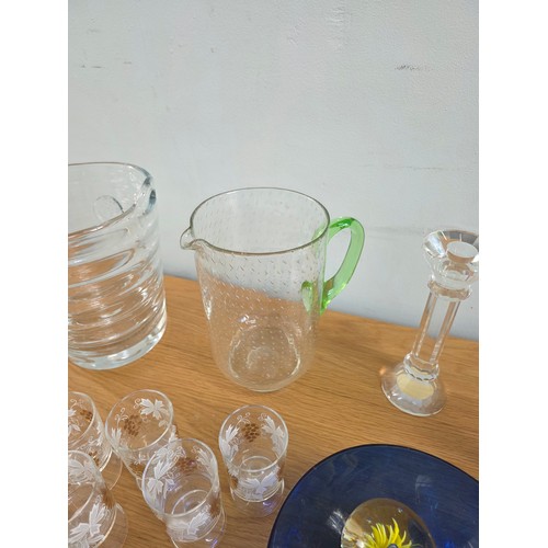 30 - A mixed lot of vintage glass to include Ice bucket, juice jug, candle sticks, paperweights, a bonbon... 