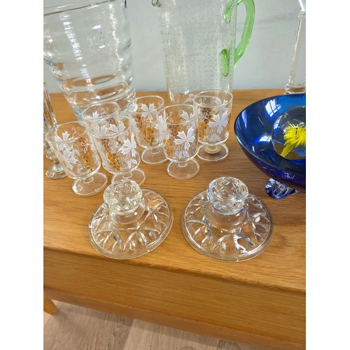 30 - A mixed lot of vintage glass to include Ice bucket, juice jug, candle sticks, paperweights, a bonbon... 