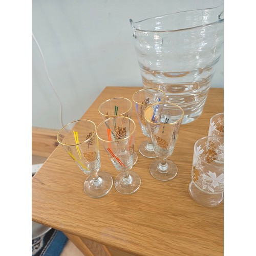 30 - A mixed lot of vintage glass to include Ice bucket, juice jug, candle sticks, paperweights, a bonbon... 