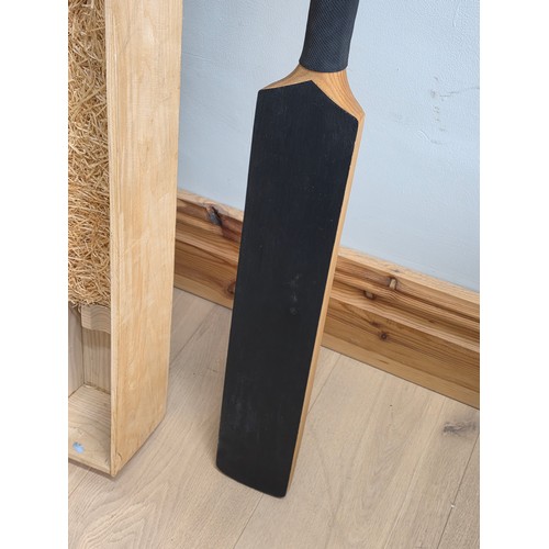 47 - A novelty chalk board in the form of traditional cricket bat with cricket ball surmount. Presented i... 