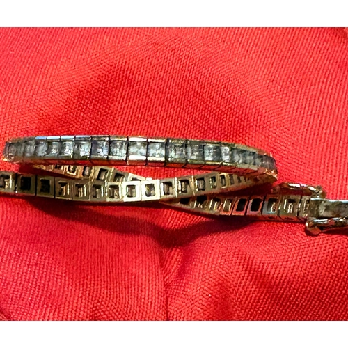 50 - An 18ct white sapphire set half tennis or center piece bracelet, set with 33 square mixed cut white ... 