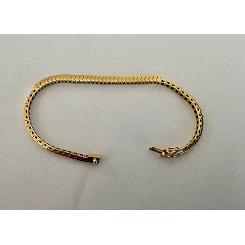 50 - An 18ct white sapphire set half tennis or center piece bracelet, set with 33 square mixed cut white ... 
