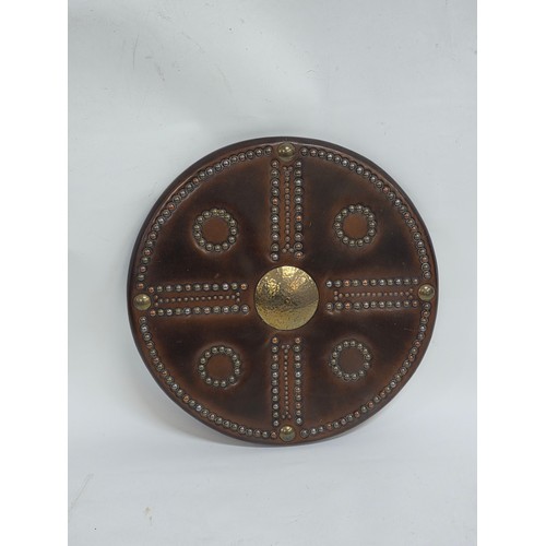 A good quality reproduction of a Scottish Targe shield, wood leather and brass