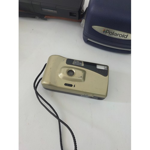 63 - A fujica single 8 P300 Cine Camera, a Polaroid Instamatic, a Halina STB, an non brabded camera, 3 ro... 