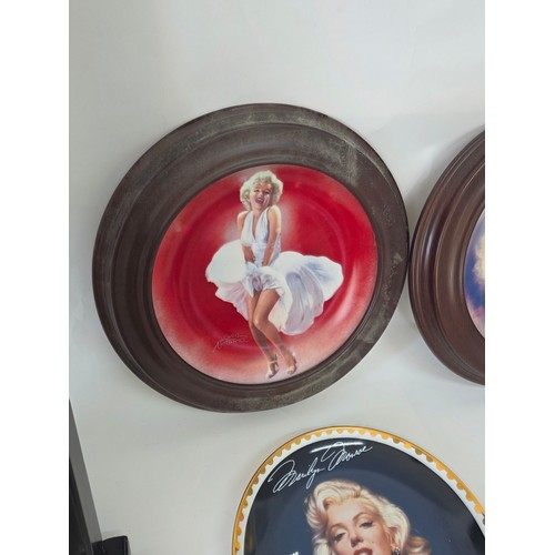 64 - Marilyn Monroe, a quantity of collector plates including a 4 plate framed Every Inch a Star set from... 