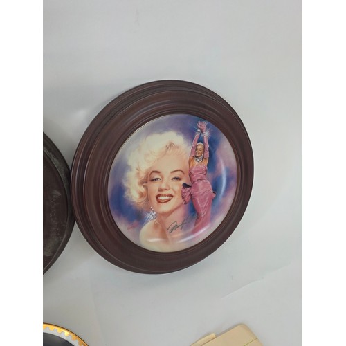 64 - Marilyn Monroe, a quantity of collector plates including a 4 plate framed Every Inch a Star set from... 
