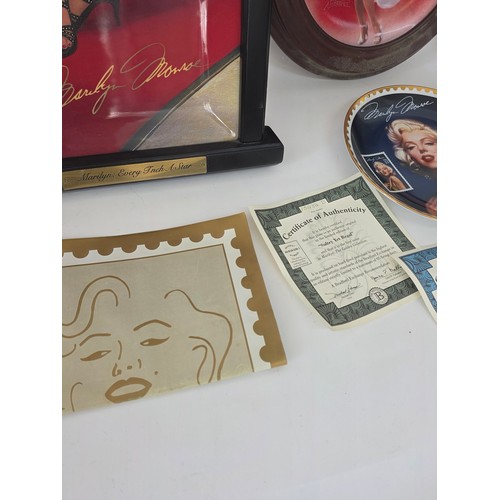 64 - Marilyn Monroe, a quantity of collector plates including a 4 plate framed Every Inch a Star set from... 