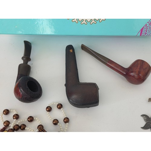 74 - A good mixed lot of collectables to include boxes, pipes, playworn cars, A Citizen TC53 pocket colou... 