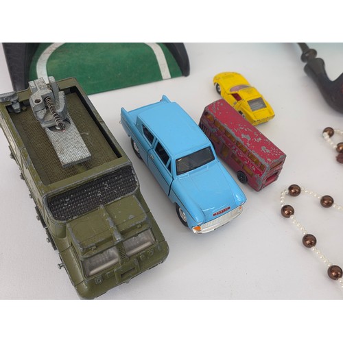 74 - A good mixed lot of collectables to include boxes, pipes, playworn cars, A Citizen TC53 pocket colou... 