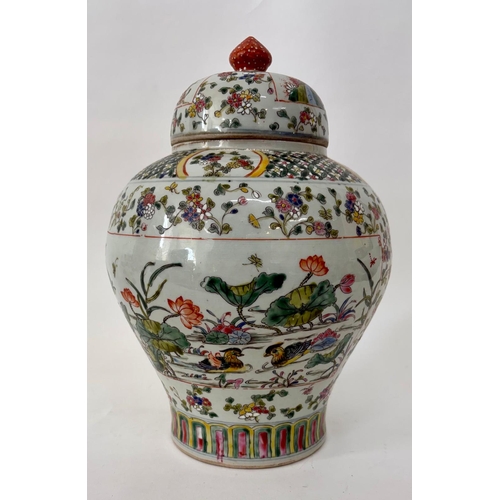 78 - A C17th style Chinese polychrome famille rose Ginger jar and coverThe base with a faux four characte... 
