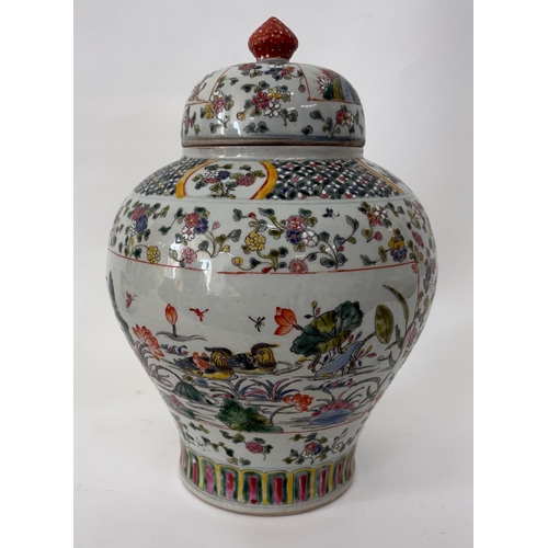 78 - A C17th style Chinese polychrome famille rose Ginger jar and coverThe base with a faux four characte... 