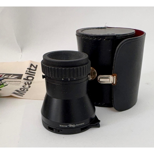 80 - A group of photographic accessories to include an Ilford SEI Exposure Photometer, Mecablitz 202/3 co... 