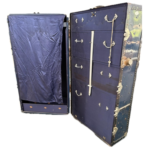 83 - A fine quality fitted travelling trunk, silk lined with 3 drawers, a hinged shoe box and wardrobe.&n... 