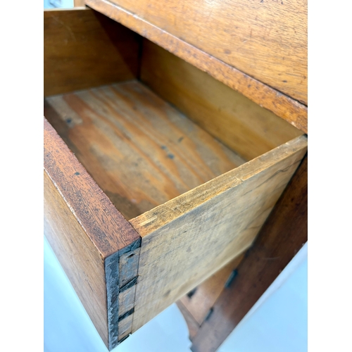 84 - An antique arts and crafts style solid walnut cabinet chestThe top with moulded edge, above two shor... 