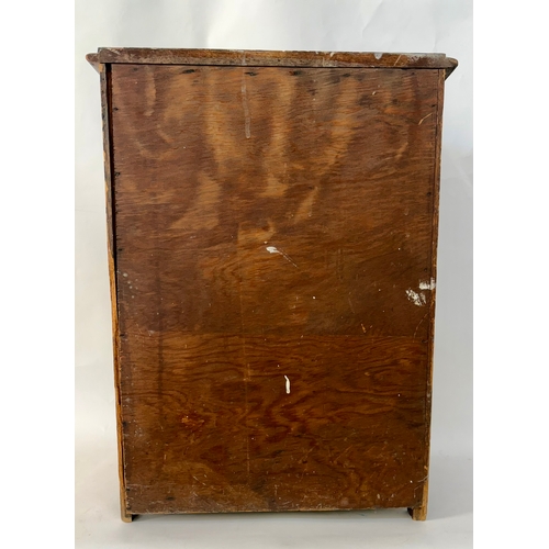 84 - An antique arts and crafts style solid walnut cabinet chestThe top with moulded edge, above two shor... 