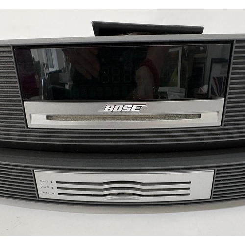 89 - A Bose Wave Music System, with a Wave Music System Multi-CD Changer.Together with cabling, manuals a... 