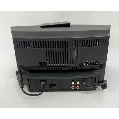 89 - A Bose Wave Music System, with a Wave Music System Multi-CD Changer.Together with cabling, manuals a... 