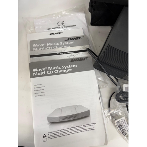 89 - A Bose Wave Music System, with a Wave Music System Multi-CD Changer.Together with cabling, manuals a... 