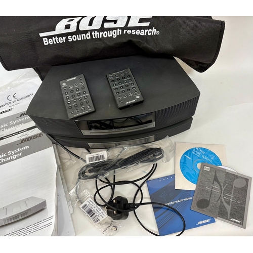 89 - A Bose Wave Music System, with a Wave Music System Multi-CD Changer.Together with cabling, manuals a... 