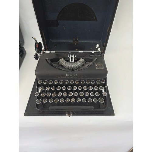 91 - Vintage Portable Typewriters. A Silver Reed Silverette hard case portable typewriter and an Imperial... 