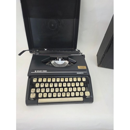 91 - Vintage Portable Typewriters. A Silver Reed Silverette hard case portable typewriter and an Imperial... 