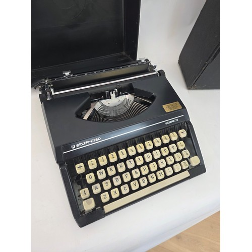 91 - Vintage Portable Typewriters. A Silver Reed Silverette hard case portable typewriter and an Imperial... 