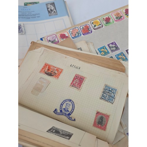 92 - Stamp Collecting. A mixed lot of vintage stamp albums and loose pages