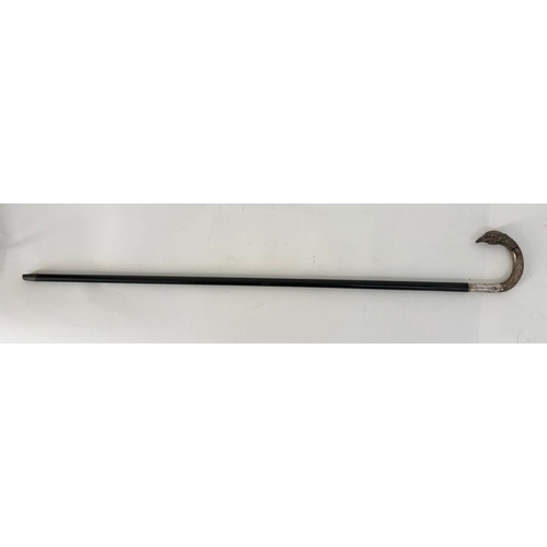 98 - A white metal late 19th century ebony colored walking cane with pheasant head handle.Engraved H.V.D.... 