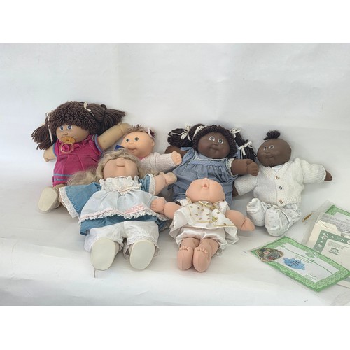103 - Original Cabbage Patch dolls, a total of 6 with three birth certificates