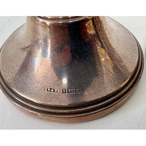 112 - A pair of Georgian style weighted squat silver candlesticksR&D Birmingham 1971(2)