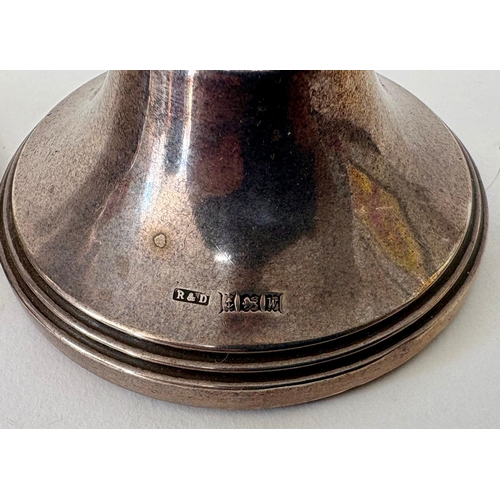112 - A pair of Georgian style weighted squat silver candlesticksR&D Birmingham 1971(2)