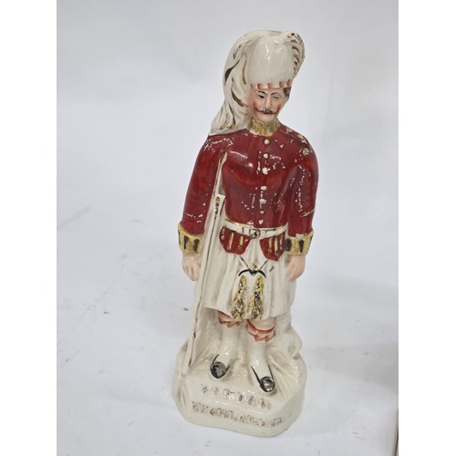 84 - Gordon Highlanders. A 19th style century Staffordshire flatback figure of a Gordon Highlander Soldie... 
