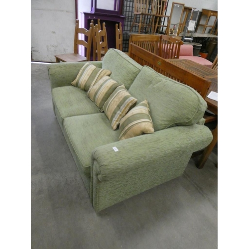 453 - Green upholstered 2 seater sofa bed (70