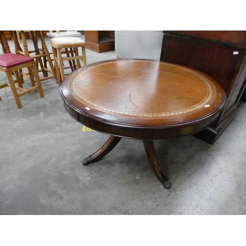 180 - Mahogany leather topped revolving drum table