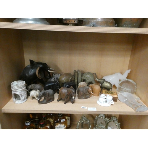 324 - Shelf of various elephant ornaments