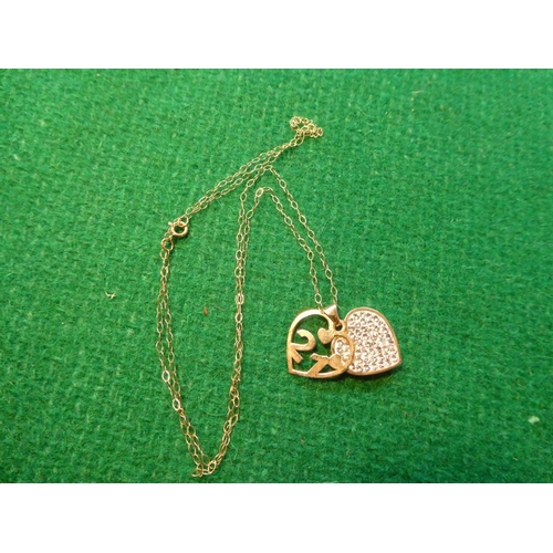 445 - 9ct gold '21' heart pendant on 9ct gold chain